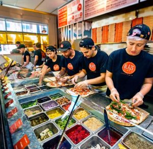 Blaze Pizza’s assembly line of toppings 