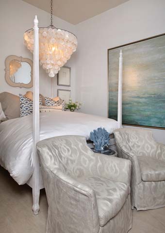 Interior designers suggest that lighting—like whimsical chandeliers—and bedding should be among the top priorities when designing a bedroom.  